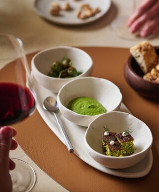 Spoon dishes filled with pistachio soup